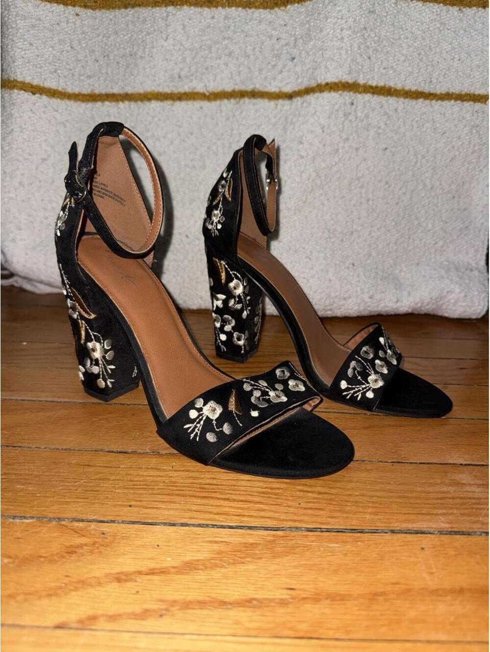 Mari A black floral heels feature a high block heel